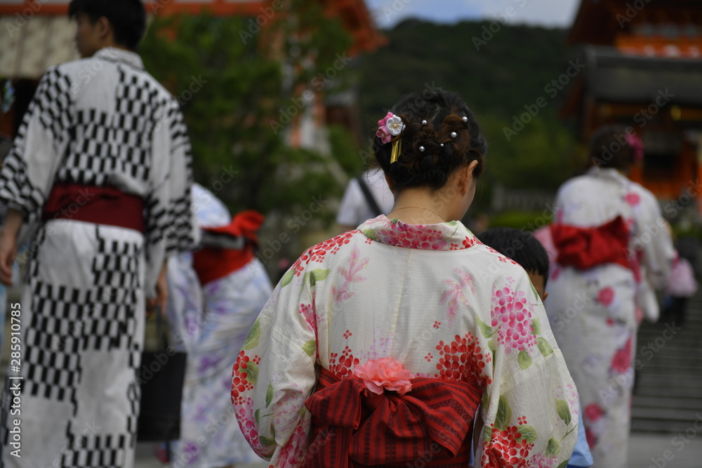 Asian people wearing Japanese traditional kimono clothes at Kiyomizu-dera temple, Kyoto, Japan.