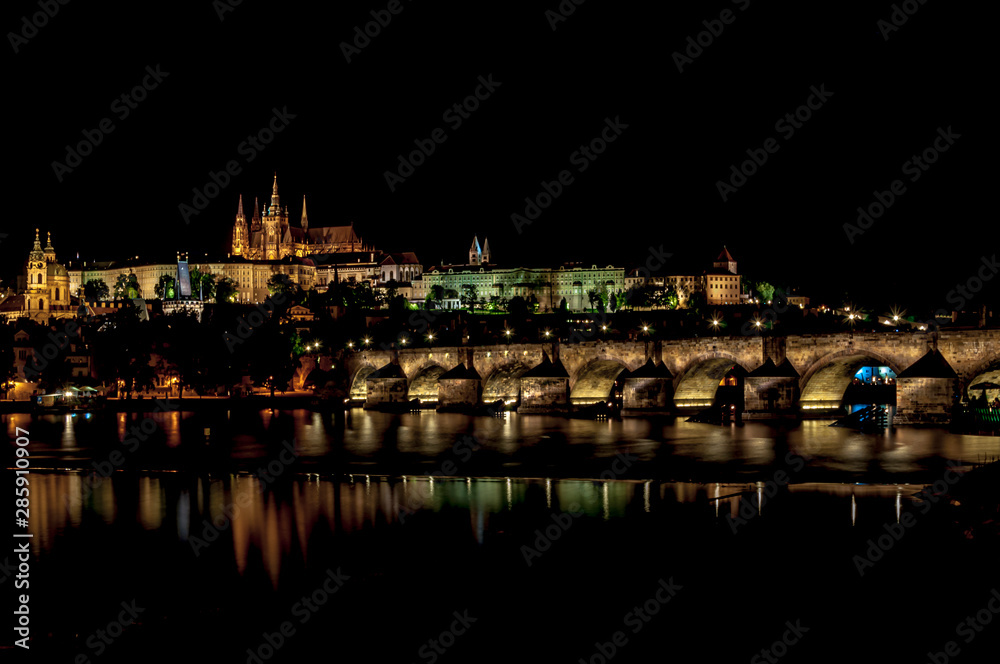 Beautiful night view of Hradcany. Classic panoramic view of Charles Bridge and Prague castle over Vltava river. Prague, Czech Republic