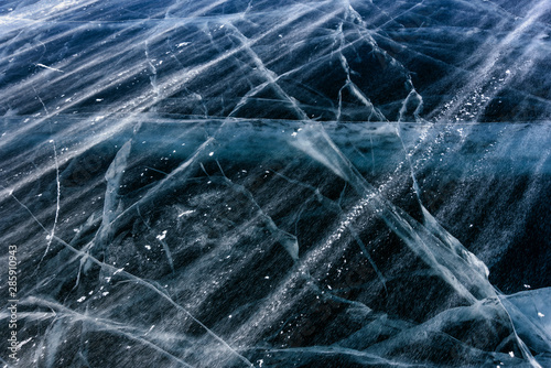 Blue cracked surface of the ice surface