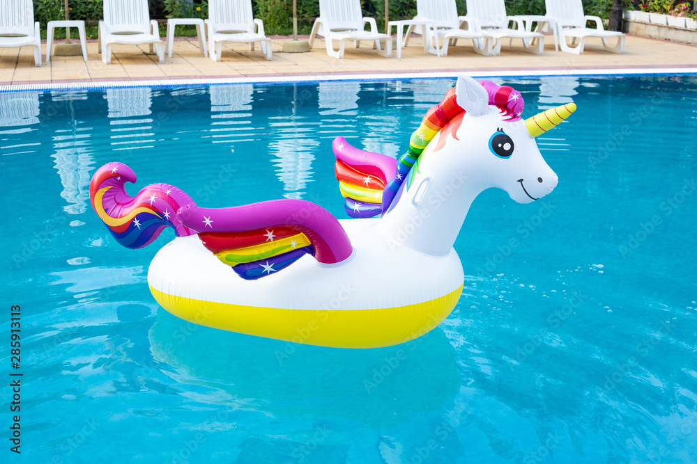 Foto de Unicorn pool float in blue water background inflatable
