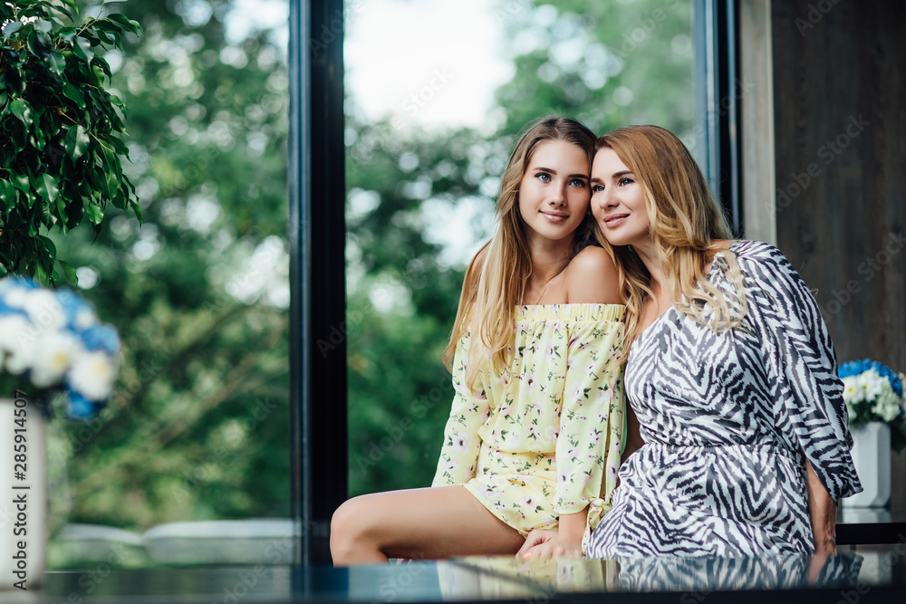 Love of mother and daughter. Happy women in a nice cafe. Aged woman and her adult daughter siting at cafe. Mothers day. Love of mother and daughter. Happy women in a nice cafe. Aged woman and her adult daughter siting at cafe. Mothers day.