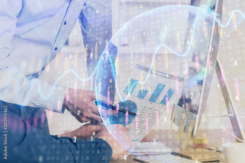Double exposure of chart with businessman typing on computer in office on background. Concept of hard work. Double exposure of chart with businessman typing on computer in office on background. Concept of hard work.