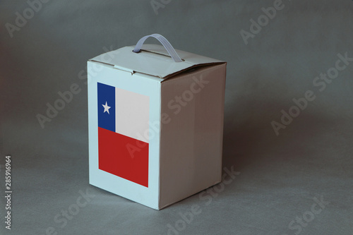 Chile flag on white box, Paper packaging for put products. The concept of Chile export trading.