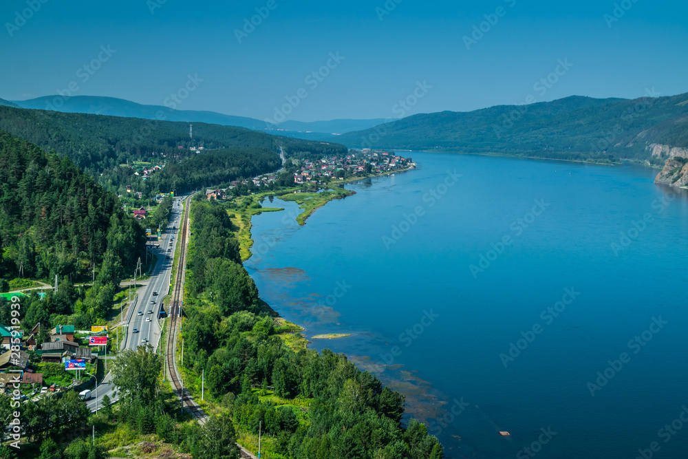 Beautiful view on Enisei rive, hills and mountains at Divnogorsk town viewpoint, Siberia, Russia