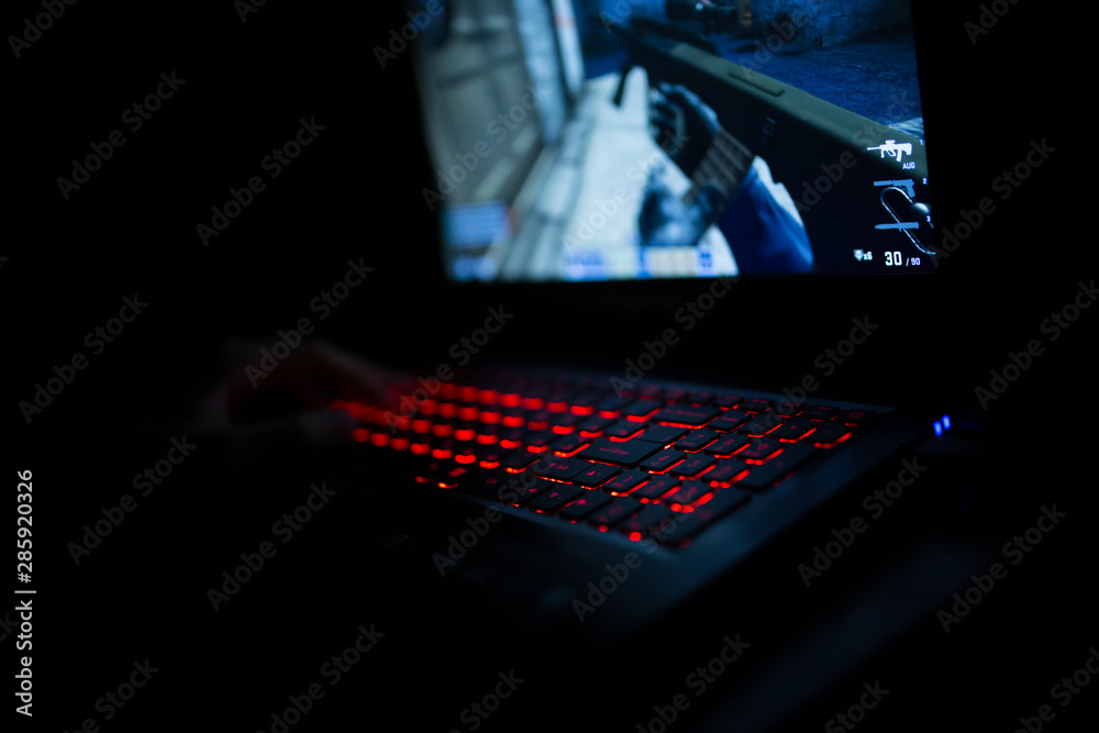 Red backlit keyboard close up. Gaming laptop. Red backlit keyboard close up. Gaming laptop.