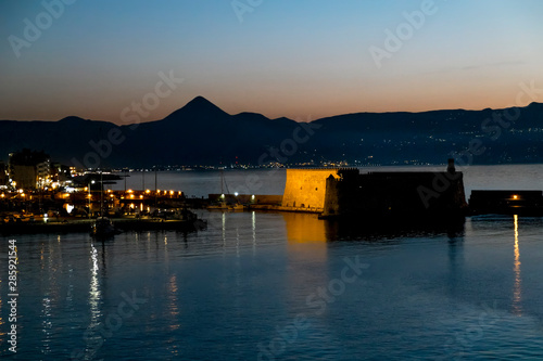  View of the fortress and ships in the port of Heraklion at sunset © toshket