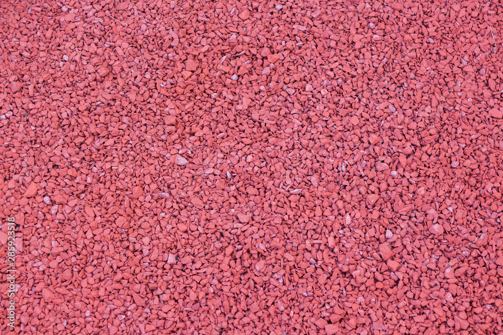 Fototapeta premium Red stone, pebbles. Texture. Background.