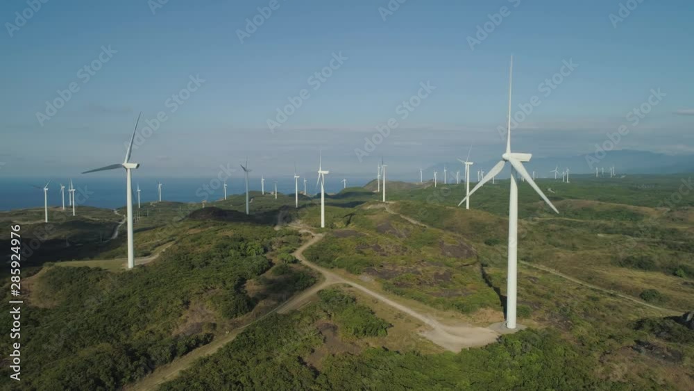 Aerial view of wind turbines for electric power production on the seashore. Bangui Windmills in Ilocos Norte, Philippines. Ecological landscape: Windmills, sea, mountains. Pagudpud Aerial view of wind turbines for electric power production on the seashore. Bangui Windmills in Ilocos Norte, Philippines. Ecological landscape: Windmills, sea, mountains. Pagudpud