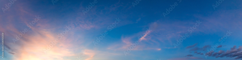 Dramatic vibrant color with beautiful cloud of sunrise and sunset on a cloudy day. Panoramic image.