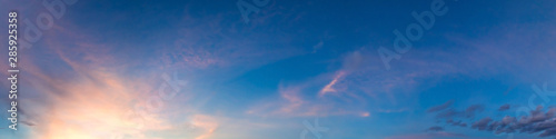 Dramatic vibrant color with beautiful cloud of sunrise and sunset on a cloudy day. Panoramic image. © tanarch