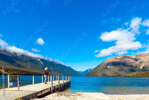 NELSON LAKES NATIONAL PARK  NEW ZEALAND - OCTOBER 16  2018  Woman on a pier at the river Rotoiti.