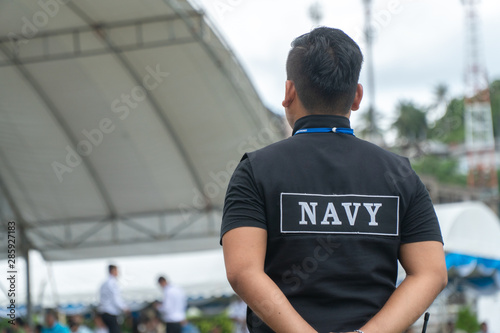 Men in the form of Thai Navy security personnel stand ready