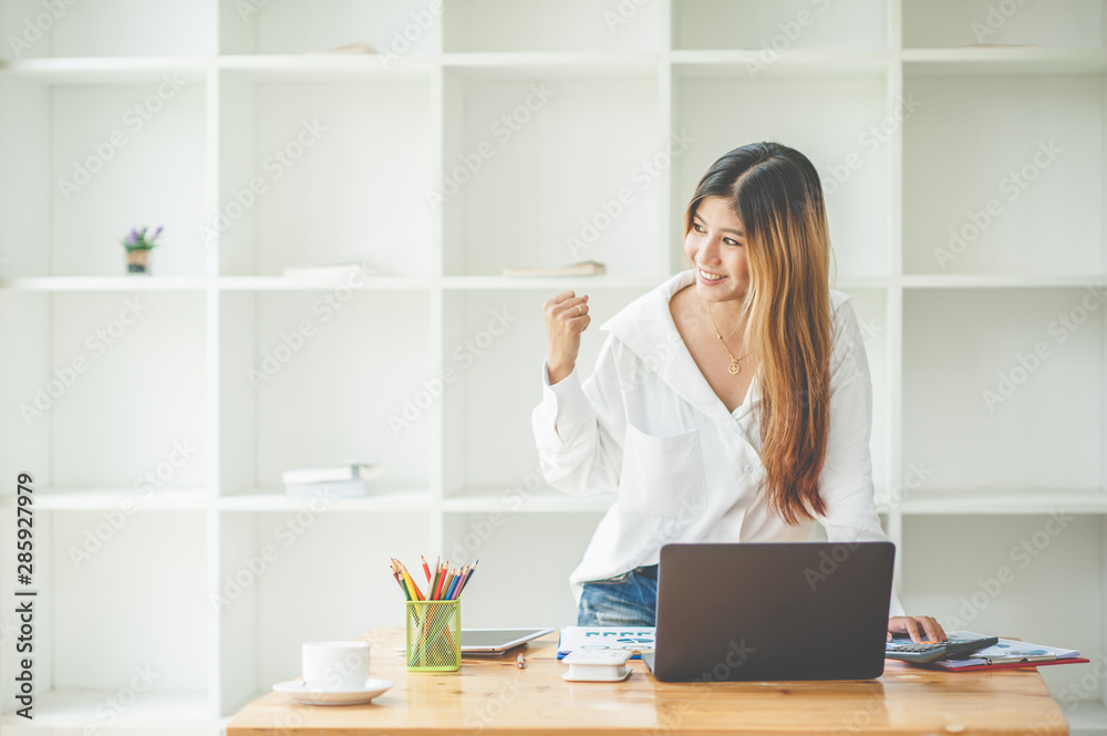 young asia woman excited and glad of success with laptop compute young asia woman excited and glad of success with laptop compute