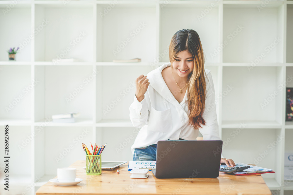 young asia woman excited and glad of success with laptop compute young asia woman excited and glad of success with laptop compute