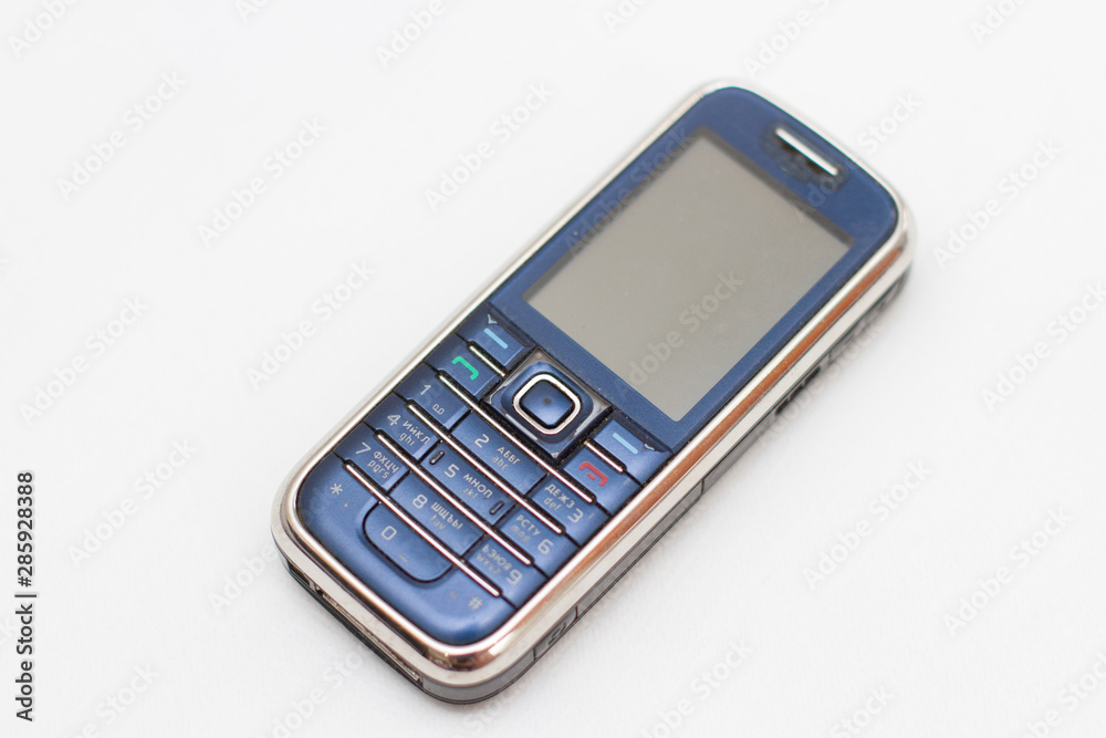 old push-button mobile phone on a white background old push-button mobile phone on a white background