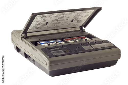 old vintage answering machine with two small tape cassettes isolated on white background
