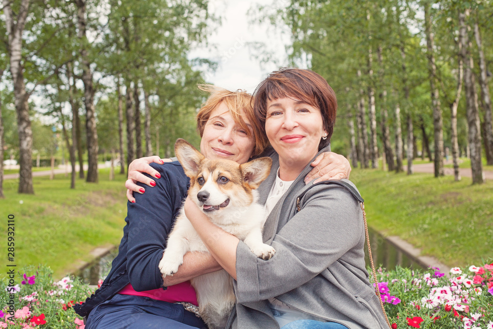 Fototapeta premium Happy female family with dog pet outdoor, lifestyle portrait