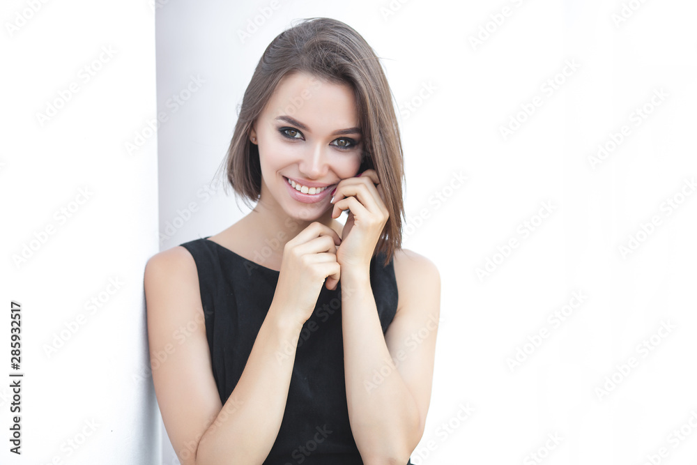 Beautiful elegant woman outdoors. Lady in black dress. Young female classic portrait. Beautiful elegant woman outdoors. Lady in black dress. Young female classic portrait.