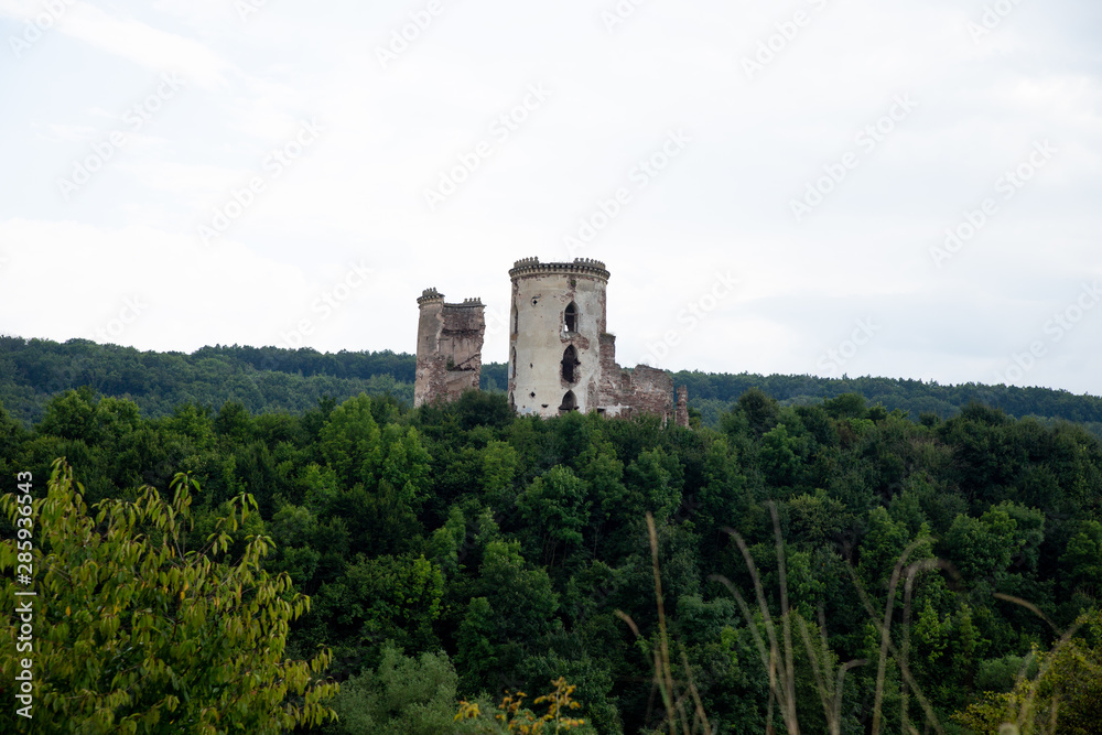 Ruins of the castle in Nirkov, towers of the Chervonograd castle, Ukraine. Nirkov, Dzhurin waterfall.