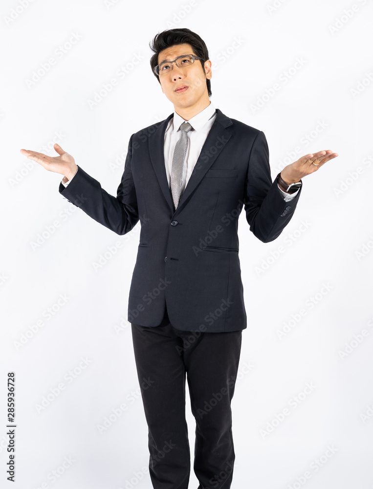 Smart businessman confused and surprised against white wall in studio Smart businessman confused and surprised against white wall in studio