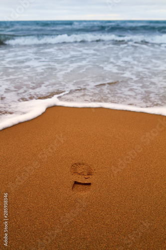 Summer sandy beach with footprint photo