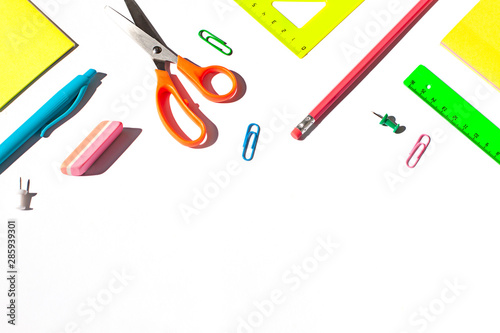 Colorful School stationery concept flat lay on the white paper background. Top view. Copy space