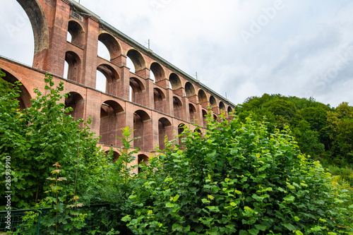 Mylau, Saxony, Germany. The Goeltzschtalbridge, the largest brick-built bridge in the world, is a major tourist attraction of the region photo