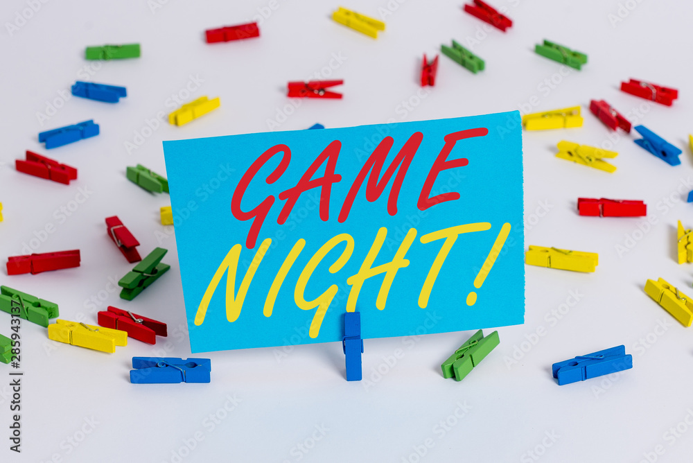 Text sign showing Game Night. Business photo text usually its called on adult play dates like poker with friends Colored clothespin papers empty reminder white floor background office Text sign showing Game Night. Business photo text usually its called on adult play dates like poker with friends Colored clothespin papers empty reminder white floor background office
