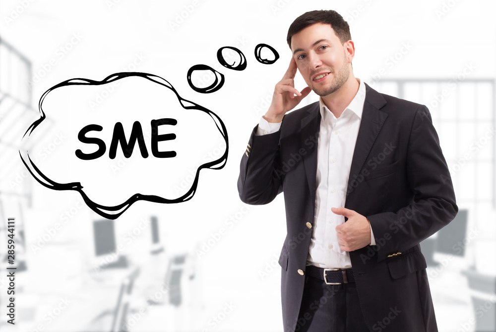 Business, technology, internet and network concept. The young businessman comes up with the keyword: SME Business, technology, internet and network concept. The young businessman comes up with the keyword: SME