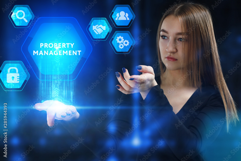 The concept of business, technology, the Internet and the network. A young entrepreneur working on a virtual screen of the future and sees the inscription: Property management