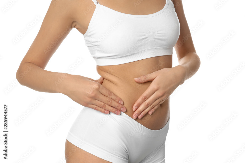 Young woman drawing attention to waist on white background, closeup. Plastic surgery concept Young woman drawing attention to waist on white background, closeup. Plastic surgery concept