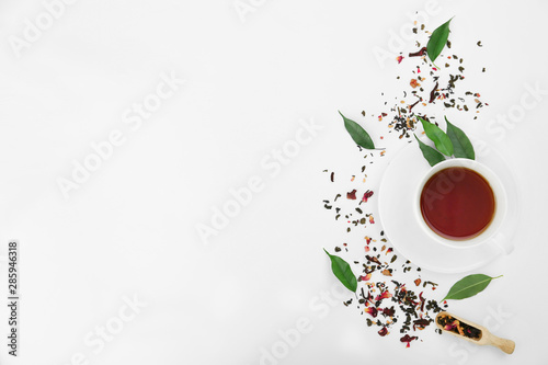 Composition with tea on white background, top view