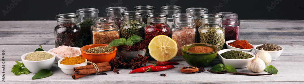 Fototapeta Spices and herbs on table. Food and cuisine ingredients with pepper