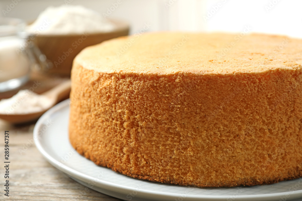 Delicious fresh homemade cake on wooden table, closeup Delicious fresh homemade cake on wooden table, closeup