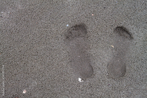 Footprints on the sand on tropical beach