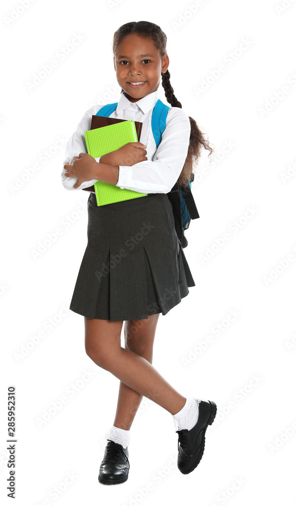 Happy African-American girl in school uniform on white background Happy African-American girl in school uniform on white background