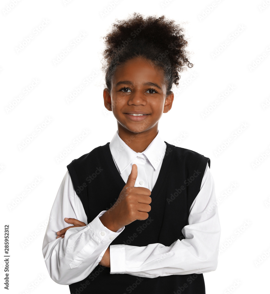 Happy African-American girl in school uniform on white background Happy African-American girl in school uniform on white background