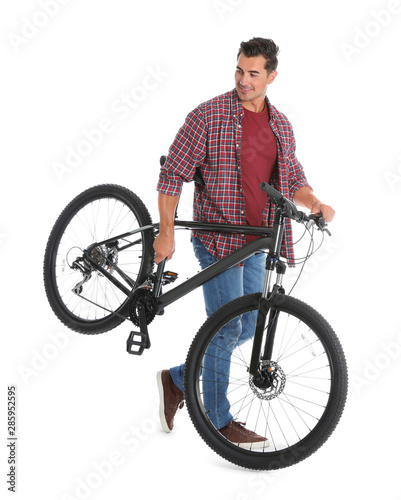 Handsome young man with modern bicycle on white background © New Africa