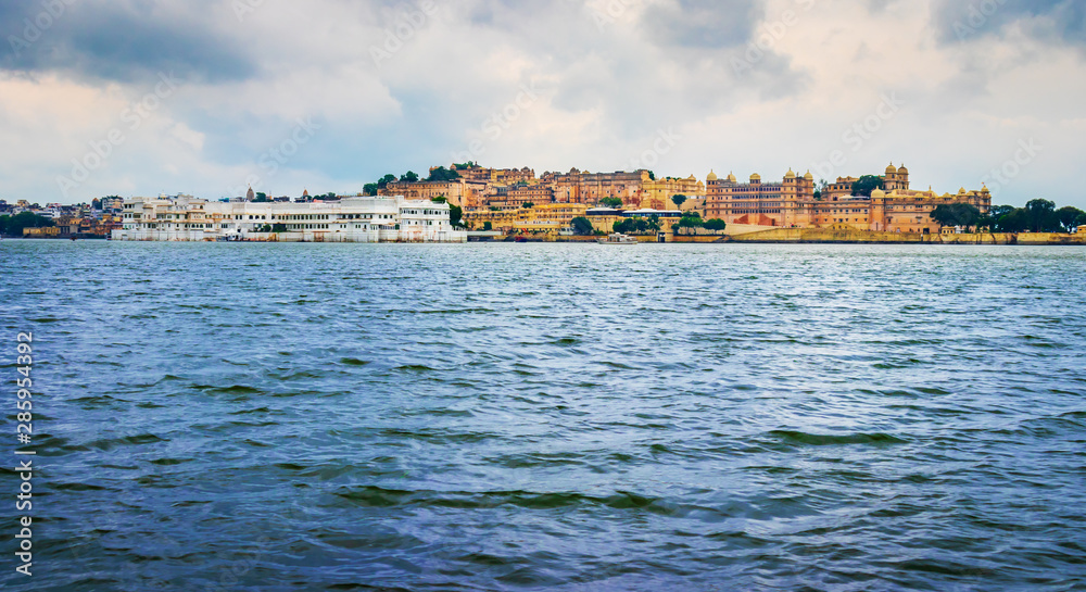 panoramic view of City palace at the banks lake pichola in Udaipur, India.