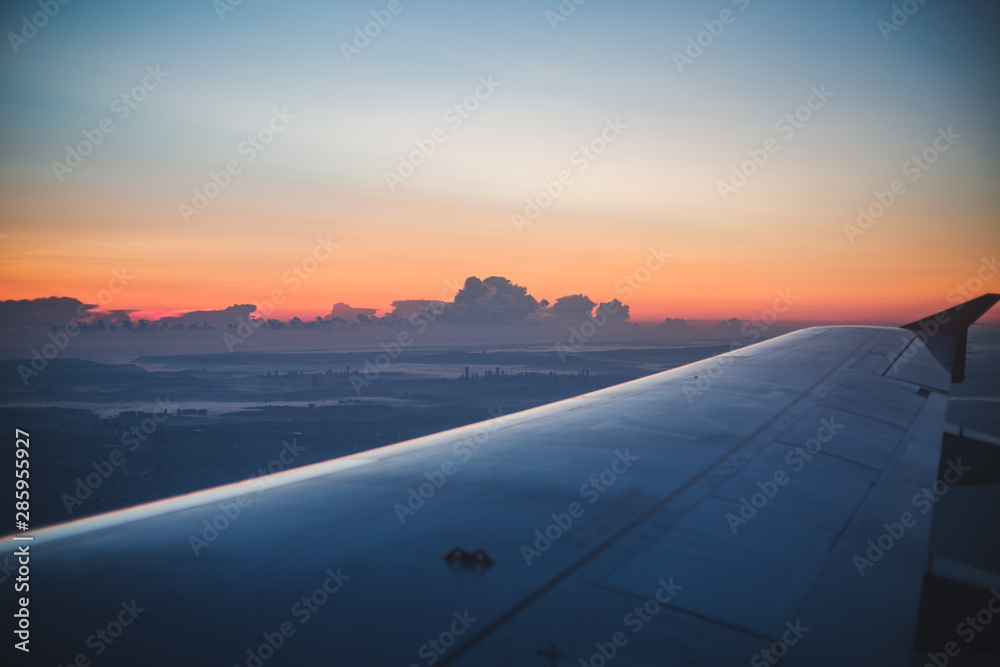 airplane flying above the clouds airplane flying above the clouds