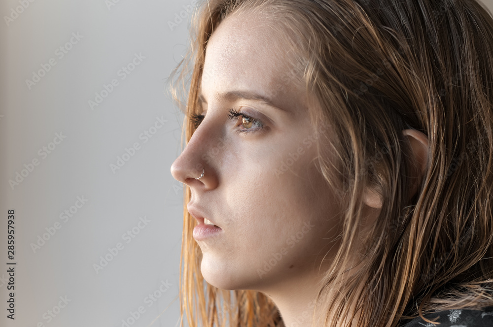 Blonde girl photographed inside a house. Blonde girl photographed inside a house.