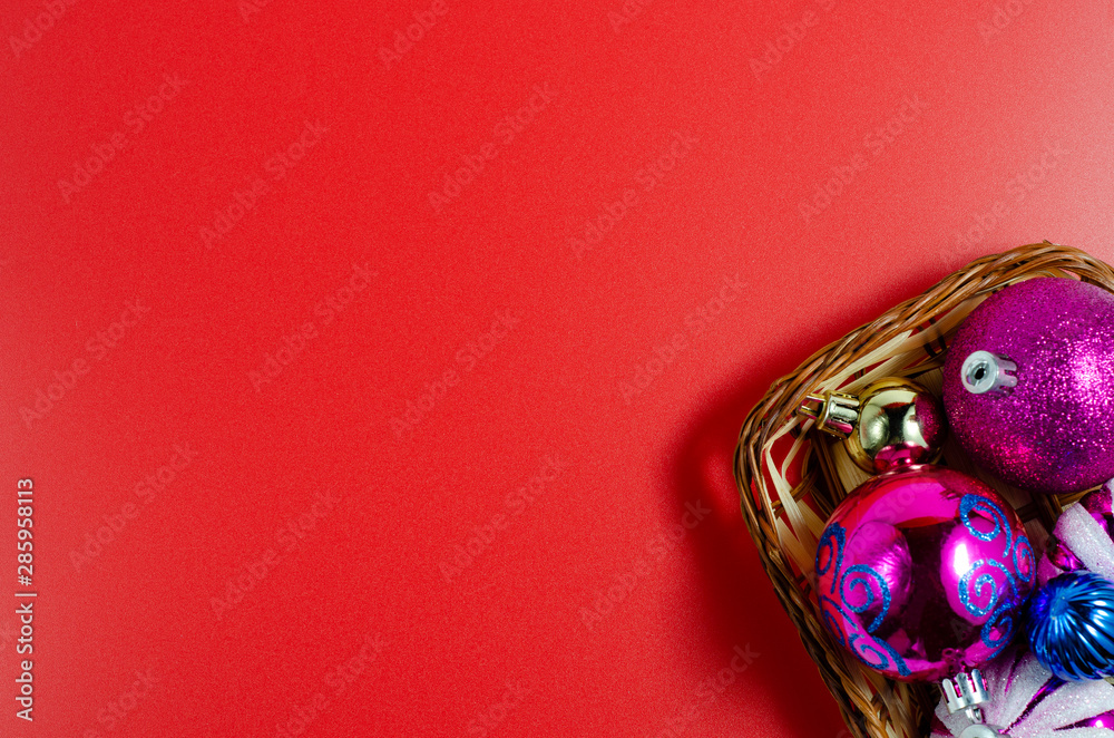 Christmas background, card with Christmas and New Year decorations. Christmas toys on a red background