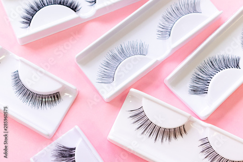 Bild auf Leinwand Various false eyelashes on a trendy pastel pink background