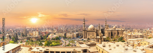 Mosque-Madrassa of Sultan Hassan in the sunset panorama of Cairo, Egypt