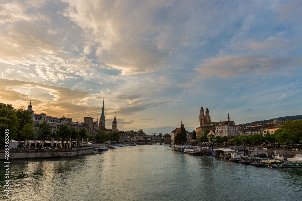 Naklejka premium Zurich downtown skyline with Fraumunster and Grossmunster churches at lake zurich during beautiful sunset, Switzerland