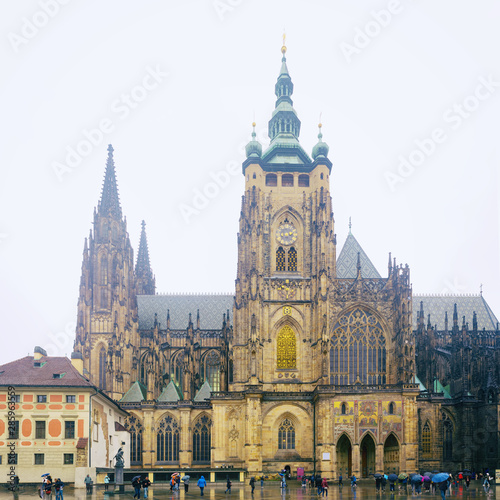 St Vitus Cathedral - Gothic Catholic Cathedral in Prague Castle. Panoramic view on a rainy spring day.