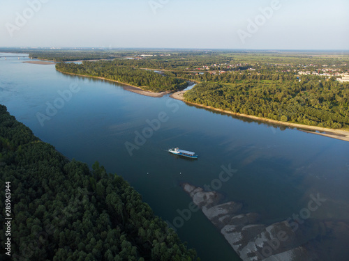 Aerial view of big siberian Ob river and ship, summer day, drone shot