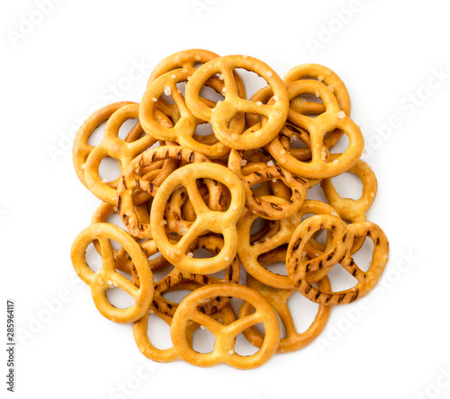 Heap of pretzels with salt on a white. The view of the top.