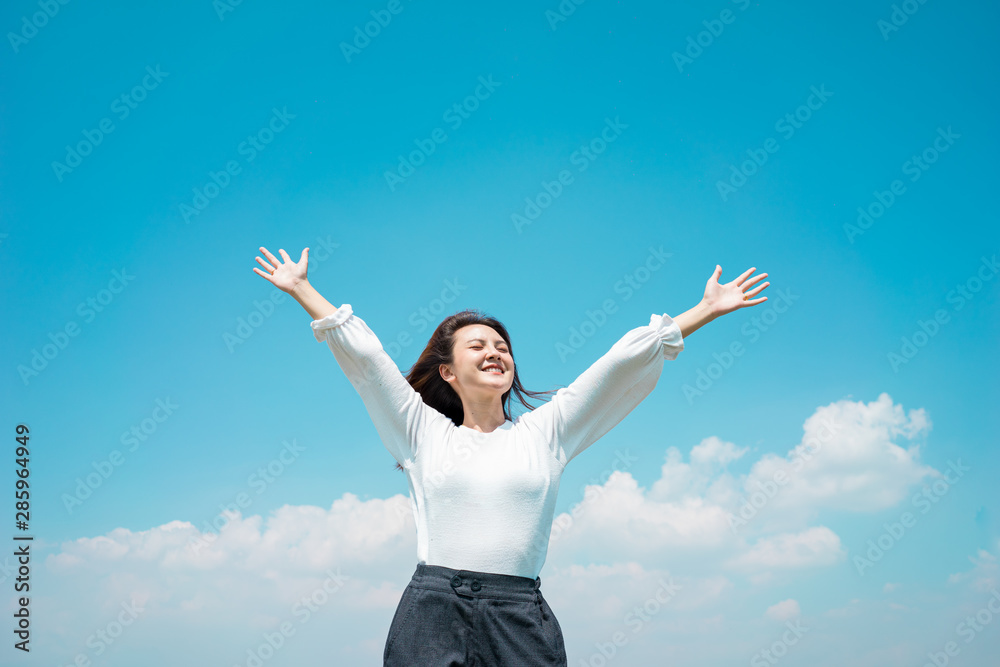 Portrait Asian woman traveller happy smiling show hand for relaxing with cloud sky. Green energy concept. Portrait Asian woman traveller happy smiling show hand for relaxing with cloud sky. Green energy concept.