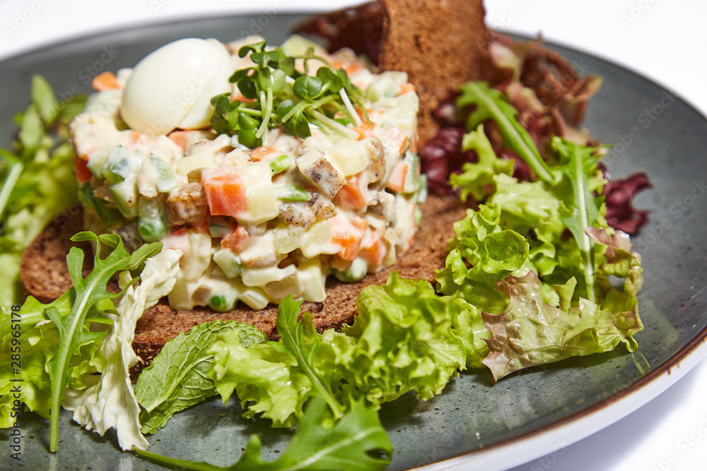 Olivier salad on a white background